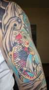 Koi on back of right arm. tattoo