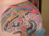 Chest and shoulder tattoo