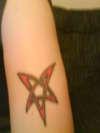 tribal star on left upper arm tattoo