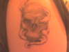 Smoking skull tattoo