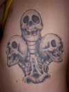 3 skulls of clubs tattoo