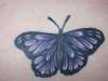 Purple cover up butterfly tattoo