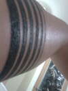 another view of six stripes in the arm tattoo