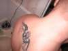 upper back cross with tribal tattoo