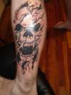 Skull with ripping effect. tattoo