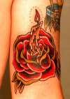 traditional rose and candle tattoo