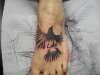 Black bird tattoo