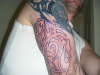 top of arm maori lining tattoo