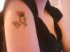 my butterfly with my nans initials in it tattoo