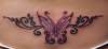 Butterfly tramp stamp tattoo