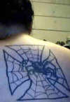Black widow and iron cross spider web tattoo