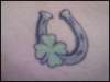 Horseshoe and clover tattoo