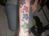 best friends on her arm tattoo