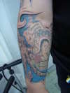 octopus (marine theme) with mother s portrait tattoo