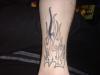 Flaming leg tattoo