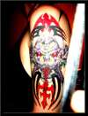 Tribal evil clown arm tat tattoo