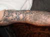 skeleton and faces tattoo