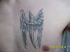 Cross with wings tattoo