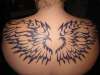 tribal wings with purple tattoo