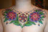 Breast piece tattoo