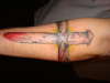 Nail cross tattoo