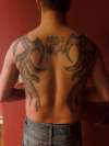 Tribal Stone Wings tattoo