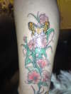 butterfly n flowers leg tattoo