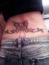 Butterfly/Daisy Lower Back Piece tattoo