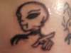 Alien character tattoo