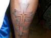 Cross Sheila tattoo