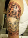 add on to skull and cross pistols tattoo