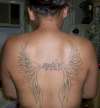 Wings w/sons name tattoo