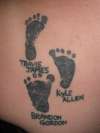 Childrens feet tattoo
