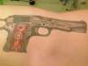 1911 on left ribs tattoo