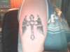 Cross with wings tattoo
