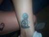 Wolf howling at the Moon tattoo