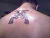six shooters tattoo