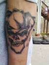 skull with joker hat tattoo