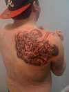 Venom mauling a man tattoo