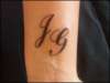 left wrist. son & boyfriends initials tattoo