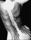 winged woman tattoo