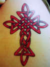 celtic cross in red tattoo