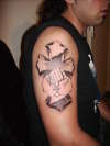 hands with cross tattoo