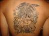 Aztec calandar wit warrior and snakes tattoo