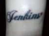 last name with a heart. tattoo