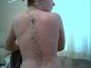 stars down back tattoo