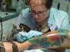 ABBY PERRY   MY artist working on best of show leg tattoo