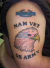 bald eagle w/ american flag & pin tattoo