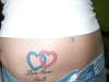 love never fails interlocked hearts tattoo