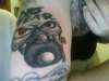 no fear logo w/ A SCBA (firefighter) mask attached tattoo
